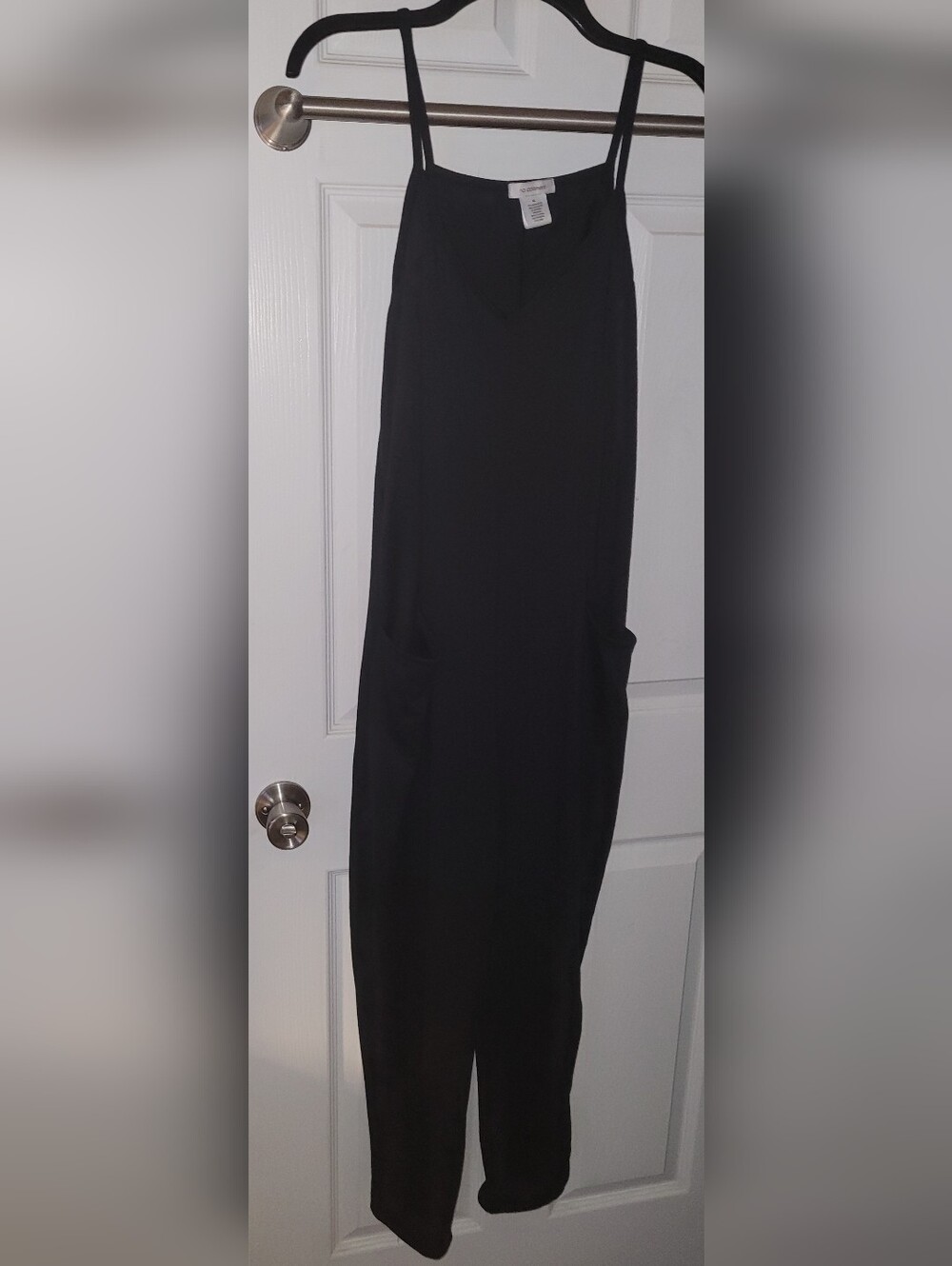 Sleek Black Spaghetti-Strap Jumpsuit with Side Pockets
